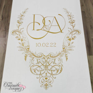 Talk about elegance! This lavish wedding logo, meticulously painted on a custom wedding aisle runner, is adorned with hanging grapes reminiscent of the Shakespearean era. Delicately intertwined and painted in gold, this design exudes sophistication on a pristine white aisle runner. "D&A" Wedding logo.