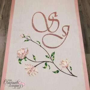 Elevate your wedding with a stunning rose-colored crystal monogram adorned with soft pink magnolias. This romantic design sets the perfect tone for a perfectly pink wedding, embracing the beauty of soft pink and rose hues. Walk down the aisle surrounded by this enchanting and personalized monogram on your aisle runner.