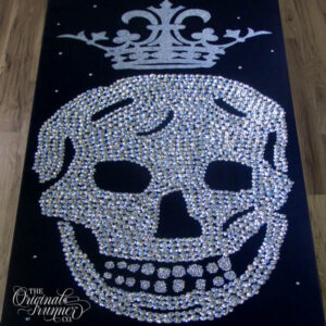 Step into the spotlight with a runway-inspired custom aisle runner that pays homage to iconic fashion designer Steve McQueen. This edgy masterpiece features a hand-crystalled skull adorned with a regal hand-painted crown, showcasing meticulous craftsmanship. Perfect for a fashion-forward wedding, Halloween celebration, or any event where glamour meets the avant-garde, this unique design sets the stage for a truly unforgettable entrance.